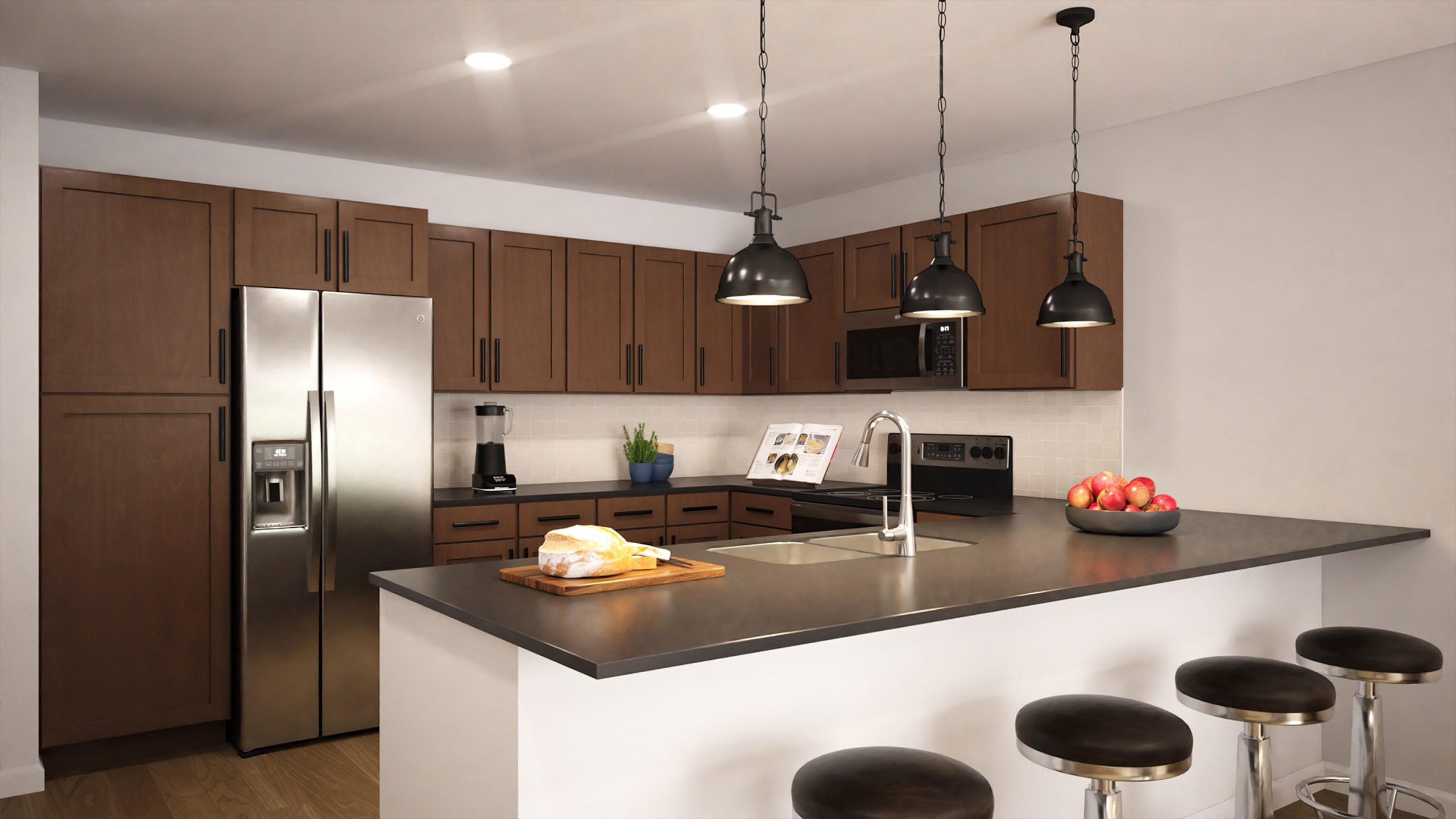 A modern kitchen with a refrigerator, sink, and bar stools.